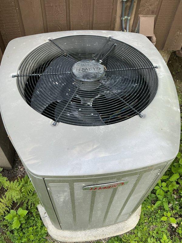 Responded to service call regarding concern about cement debris potentially falling into outdoor Lennox heat pump unit. Performed thorough inspection of one-year-old unit including removal of top fan grille to examine fan blade assembly, motor, and interior cabinet for foreign material or damage. Found no cement, debris, or obstructions present in fan assembly or condenser coil area. Verified unit operational integrity, confirmed proper fan motor function, and cleared system for normal operation.
