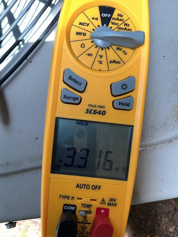 Performed standard air conditioning tune-up and system inspection. Conducted electrical diagnostics using digital multimeter, recording capacitor readings of 33.16 and 29.02 microfarads to verify proper compressor and fan motor operation. All measurements within acceptable parameters for continued system performance.