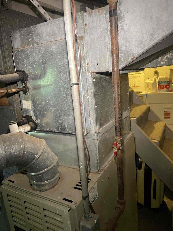 Completed full system estimate for a 30-year-old natural gas forced air HVAC system in a colonial-style residence that was not operational. Documented existing equipment conditions including aged furnace and air conditioning components, assessed ductwork transitions and connections, evaluated electrical controls and gas piping infrastructure, and provided comprehensive replacement recommendations for the complete heating and cooling system.