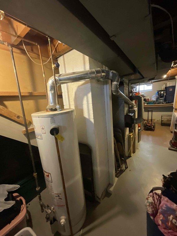 Responded to service call for four-year-old central air conditioning system not cooling with suspected refrigerant leak. Performed comprehensive system evaluation including inspection of indoor furnace unit, ductwork connections, and outdoor condensing unit to identify cooling failure cause. Documented equipment conditions and provided full system replacement estimate per BOGO promotion eligibility.