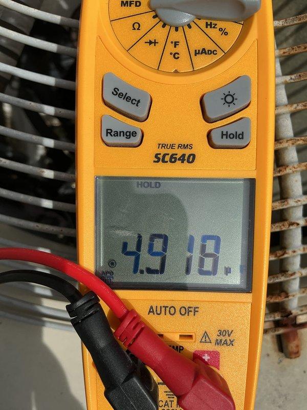Responded to heat pump system experiencing outdoor fan failure and coil freezing issues. Upon inspection, diagnosed failed dual run capacitor with readings of 43.11 and 49.18 MFD, both below manufacturer specifications, preventing condenser fan motor operation in both heating and cooling modes. Replaced defective capacitor, restored system to proper operation, and performed general assessment of 16-year-old furnace as requested.