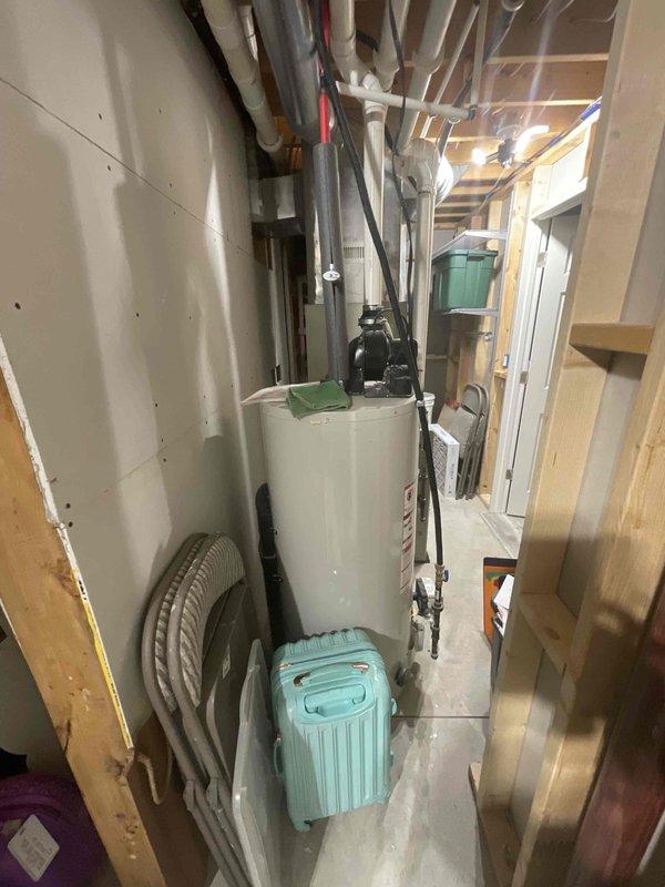 Completed estimate for full HVAC system replacement including furnace and air conditioning unit. Existing 12-year-old natural gas furnace and AC system located in basement are non-operational and require replacement. Assessed installation site in unfinished basement utility area with exposed framing and evaluated exterior condensing unit mounting location on building exterior with vinyl siding. Provided replacement options for complete heating and cooling system to restore climate control functionality.