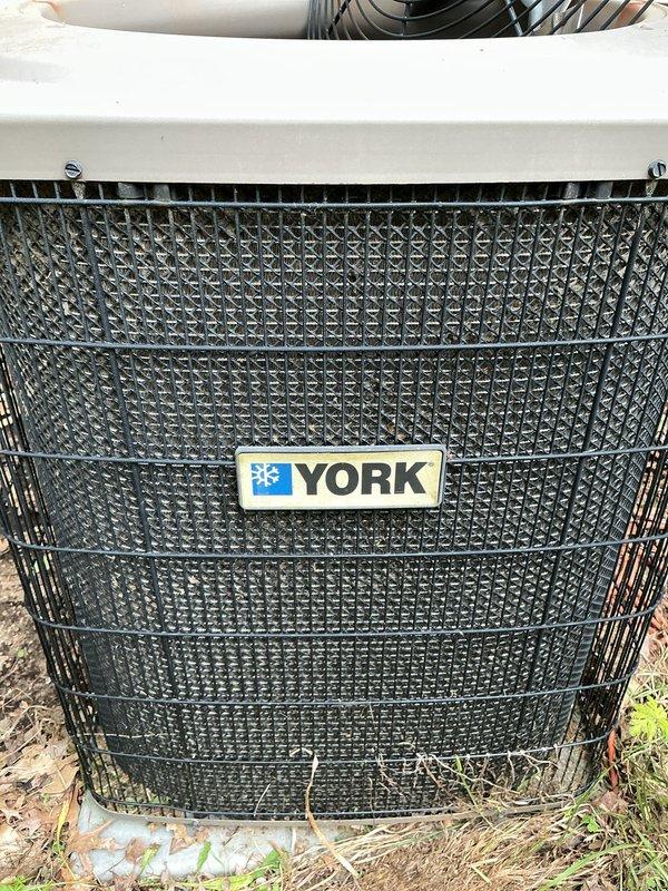 Performed standard preventative maintenance service on York brand air conditioning system. Conducted visual inspection of outdoor condenser unit, verified operational status, and documented equipment condition through photographs. Unit found to be in functional working order with normal signs of outdoor weathering. No immediate repairs or concerns identified during service call.