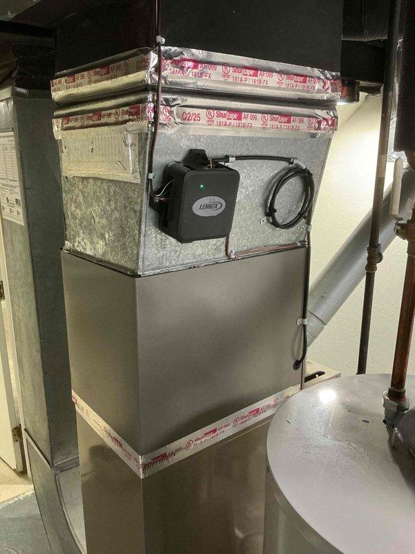 Completed installation of 1.5-ton air conditioning system with new evaporator coil at rear of property. Installed outdoor condensing unit on pad with proper clearances, connected refrigerant lines, and integrated new coil with existing furnace system in basement. System tested, charged to manufacturer specifications, and verified operational with all electrical connections, condensate drainage, and airflow confirmed functioning properly.