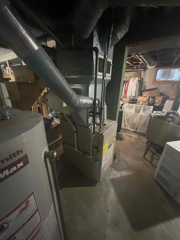 Completed estimate for replacement of existing basement-located natural gas furnace and air conditioning system. Current equipment is operational but age unknown. Assessed installation requirements for new HVAC system in basement utility area with existing ductwork infrastructure and verified clearance space for equipment replacement.