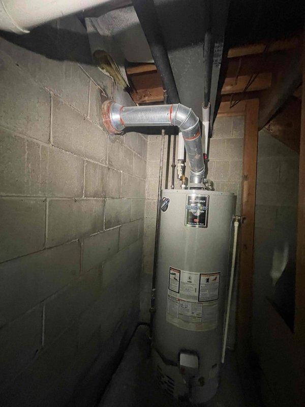 Conducted on-site assessment for complete HVAC system replacement including 15-year-old furnace and air conditioning unit. Evaluated existing equipment installation in basement utility area, documented current system configuration including ductwork connections, ventilation routing, and spatial considerations for new equipment placement. Photographed existing infrastructure to facilitate accurate replacement specifications and ensure proper sizing for new high-efficiency heating and cooling systems.