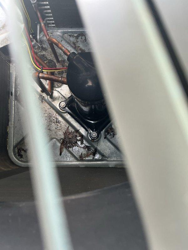 Completed annual preventative maintenance on air conditioning system. Inspected evaporator coil with honeycomb media filter showing moderate dust accumulation and discoloration, indicating normal seasonal use. Checked condensate pump operation and drainage system, noting mineral deposits in collection pan. Examined refrigerant lines, electrical connections, and control components for proper operation and secure mounting. All system components functioning within normal parameters upon completion of inspection.