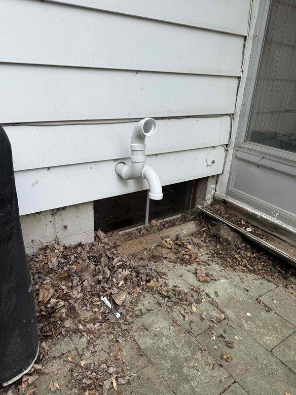 Completed full HVAC system installation including a 70,000 BTU furnace and 2-ton air conditioning unit with rear discharge configuration. Installed condensate drainage line with PVC piping routed to building exterior, reconnected all existing ductwork and utilities, and verified proper system operation. All mechanical permits obtained and installation completed per code requirements in basement utility area.