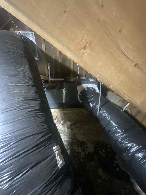 Conducted comprehensive assessment of existing HVAC system for full replacement estimate. Both air conditioning unit and heating system are approximately 2 years old and currently operational without reported malfunctions. Inspected attic and crawl space areas, documenting existing ductwork configuration including flexible ducts and metal plenum connections. Evaluated current insulation conditions and ductwork routing throughout confined spaces. Photographed installation areas to document existing system layout and accessibility for proposed equipment replacement. Provided detailed replacement estimate for complete AC and furnace system upgrade per customer request for expedited installation.