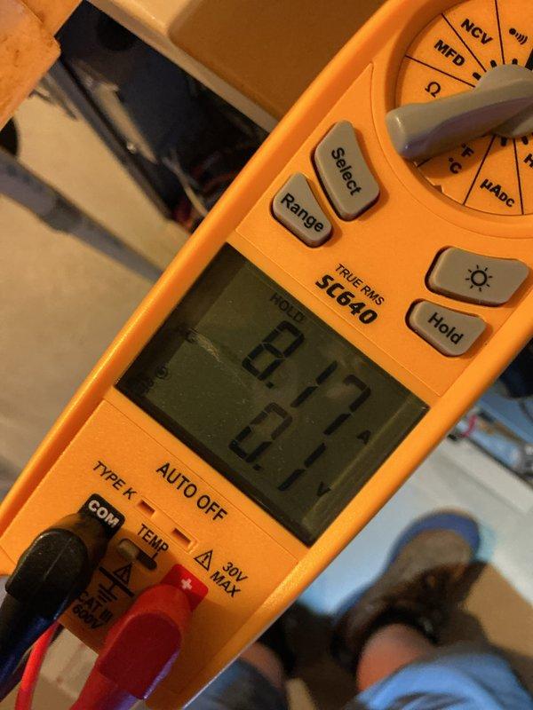 Completed routine annual tune-up on 20-year-old residential air conditioning system. Performed comprehensive inspection of outdoor condenser unit, verified electrical connections, and measured system capacitance reading of 0.27 using digital multimeter. All components operating within normal parameters with no issues identified during inspection. System confirmed ready for cooling season operation.