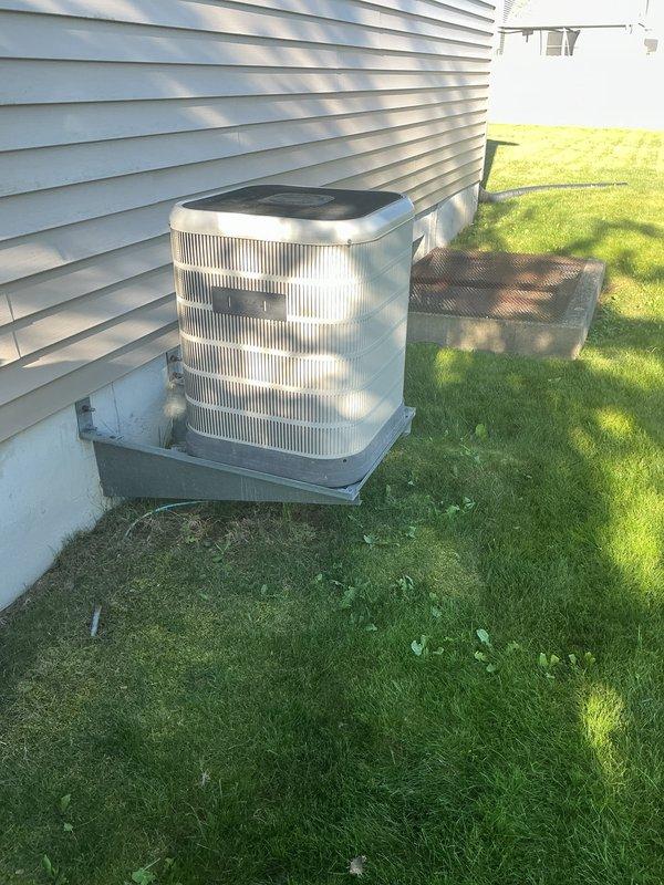 Completed comprehensive tune-up on 19+ year old outdoor air conditioning condenser unit. Performed full system inspection including condenser coils, refrigerant levels, electrical connections, and fan motor operation. Also inspected and evaluated humidifier, thermostat functionality, and hot water tank as part of complete HVAC system assessment.