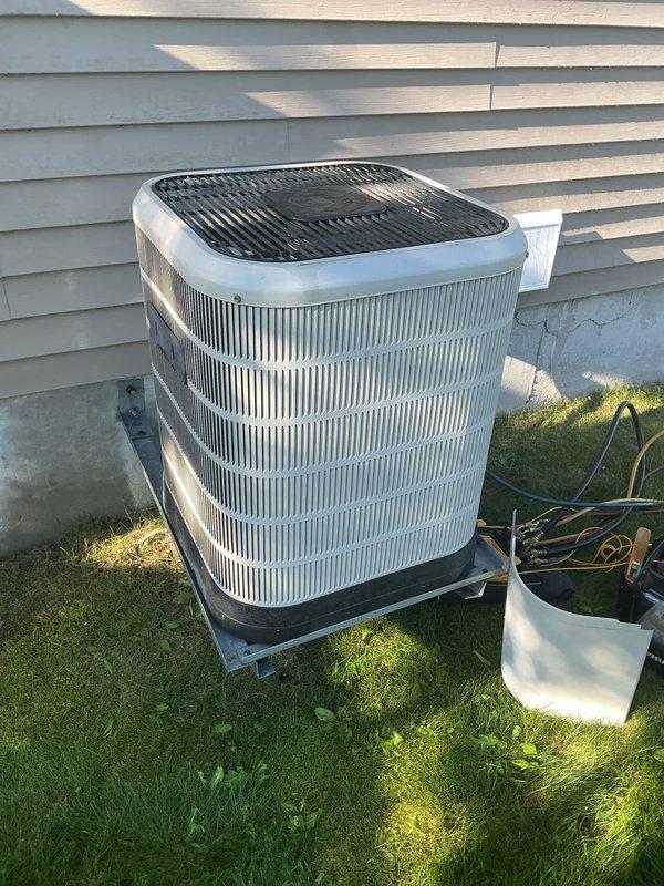Completed comprehensive tune-up on 19+ year old outdoor air conditioning condenser unit. Performed full system inspection including condenser coils, refrigerant levels, electrical connections, and fan motor operation. Also inspected and evaluated humidifier, thermostat functionality, and hot water tank as part of complete HVAC system assessment.