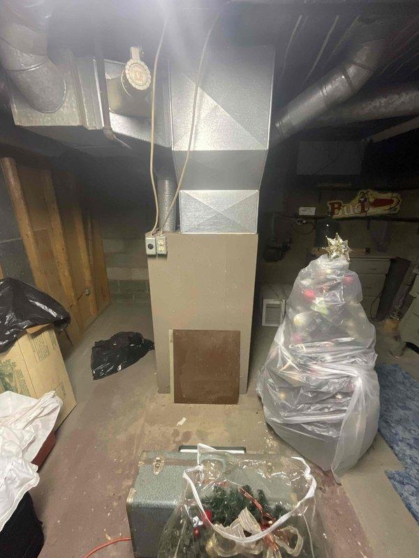 Conducted full system estimate for residential HVAC replacement in basement installation. Evaluated existing 16-year-old furnace and assessed space for addition of central air conditioning system, as current setup lacks cooling capability. Inspected utility area including electrical panel, existing ductwork infrastructure, and available space for new equipment installation. Documented current system configuration and provided comprehensive quote for complete furnace and AC system replacement to meet customer's cooling needs within the current season timeframe.