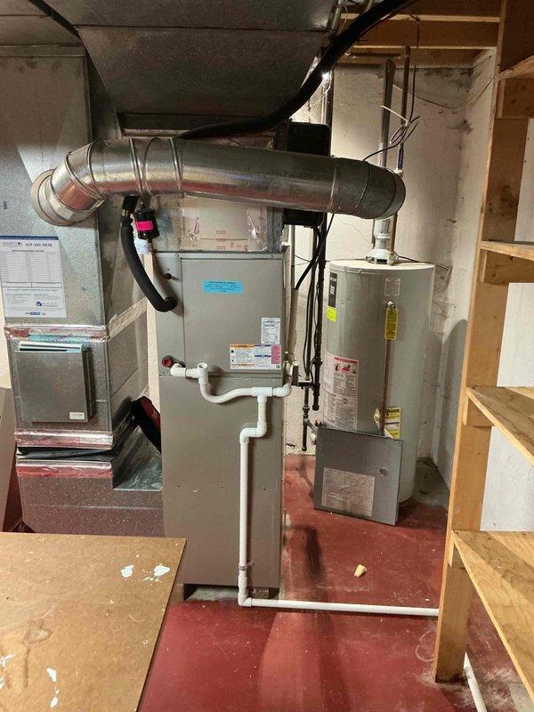 Completed annual maintenance service on HVAC system including heating and cooling units. Performed hot water tank inspection, replaced air filters, and installed new evaporator pads on humidification system. All equipment operating within normal parameters upon completion of service.
