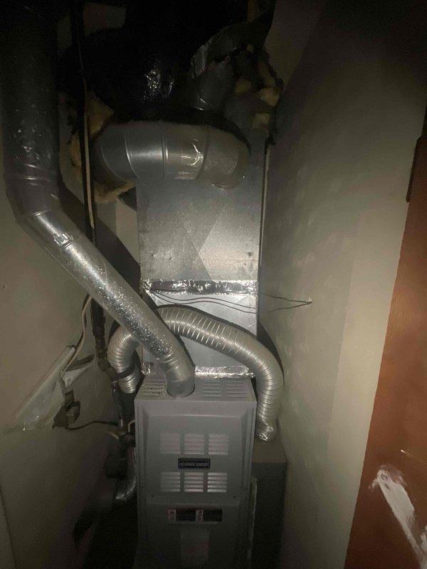 Completed HVAC system replacement in residential utility closet. Installed new Command brand furnace unit with associated flexible aluminum ductwork and air handler components. All equipment properly connected and positioned within confined mechanical space, with ductwork routed to distribute conditioned air throughout the residence.