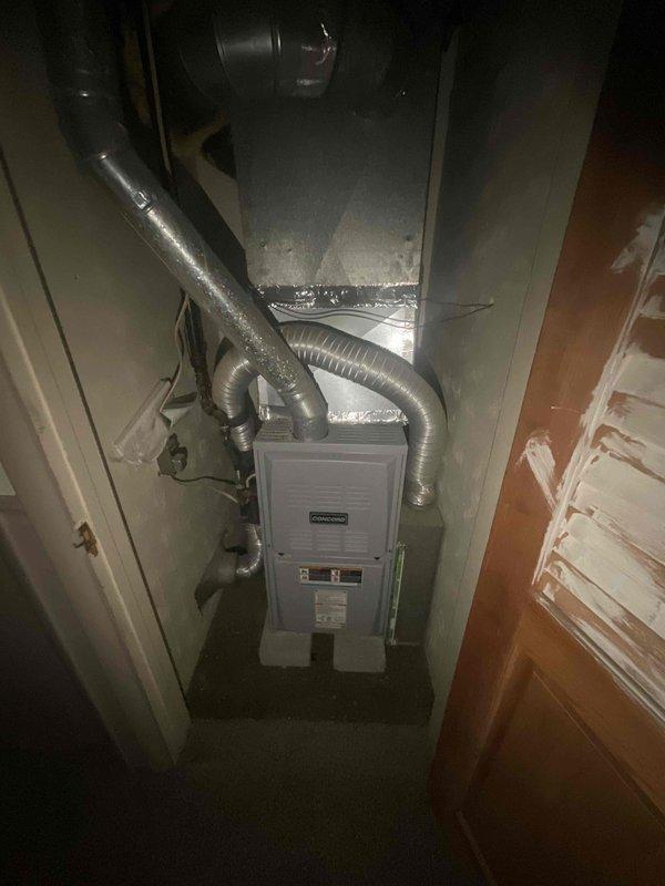 Completed HVAC system replacement in residential utility closet. Installed new Command brand furnace unit with associated flexible aluminum ductwork and air handler components. All equipment properly connected and positioned within confined mechanical space, with ductwork routed to distribute conditioned air throughout the residence.