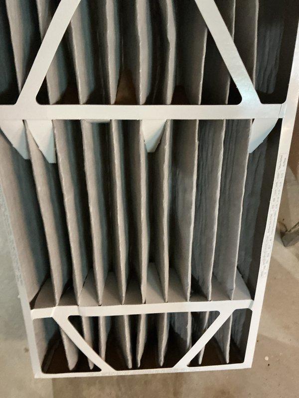 Completed annual cooling maintenance on HVAC system. Replaced dirty air filter and evaporator coil pad, both showing significant dust and debris accumulation. Documented condition of evaporator coils which displayed heavy contamination on fins, indicating need for improved filtration and regular maintenance schedule.