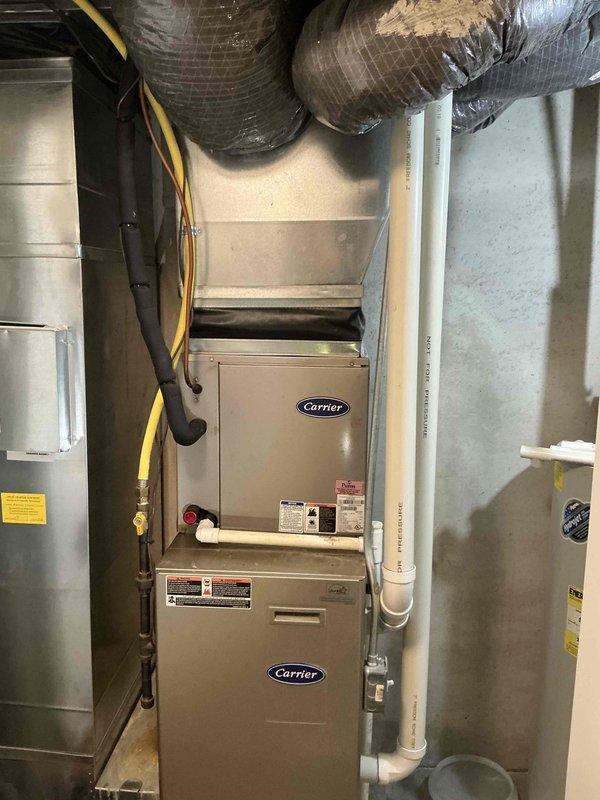 Completed full system estimate for replacement of 20-year-old air conditioning and furnace system that was not blowing cold air. Assessed existing Carrier furnace installation in basement mechanical room along with outdoor AC unit, documented current equipment configuration including ductwork, refrigerant lines, condensate drainage, and venting systems. Provided comprehensive replacement options for complete HVAC system upgrade.