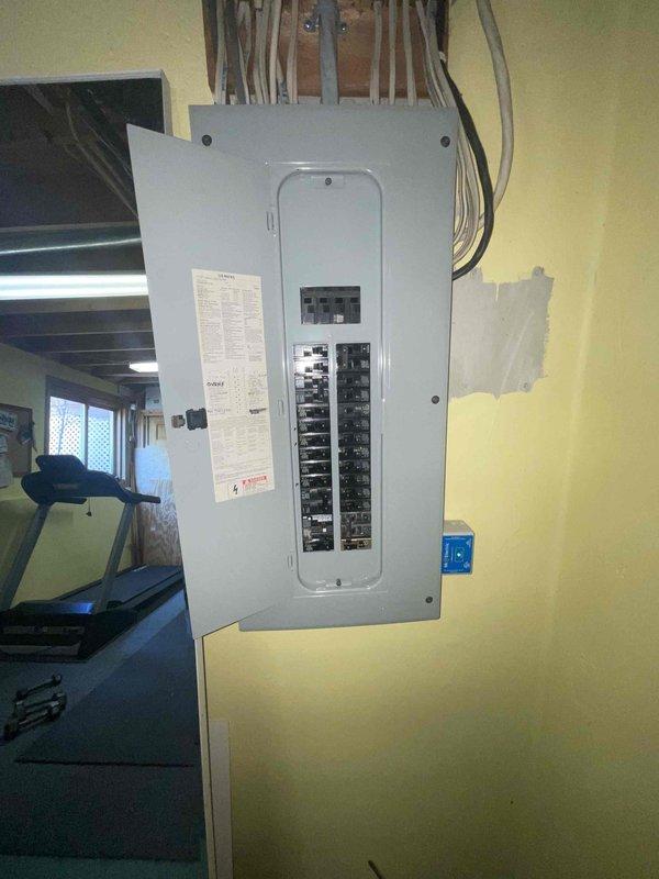 Responded to customer request for air conditioning replacement estimate due to 16-year-old system providing no cooling. Assessed basement-located HVAC equipment and existing electrical infrastructure, including main circuit breaker panel and power supply routing, to determine requirements for complete system replacement. Documented current electrical connections and panel configuration to ensure proper specifications for new equipment installation.