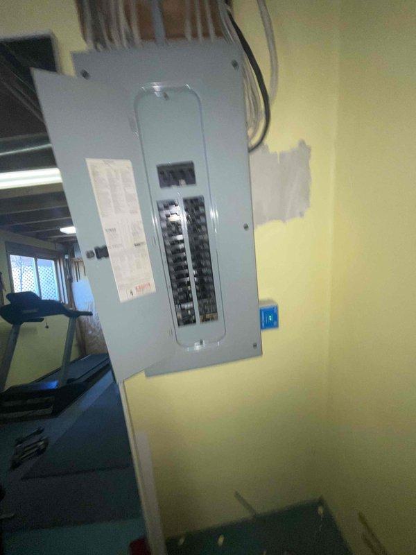 Responded to customer request for air conditioning replacement estimate due to 16-year-old system providing no cooling. Assessed basement-located HVAC equipment and existing electrical infrastructure, including main circuit breaker panel and power supply routing, to determine requirements for complete system replacement. Documented current electrical connections and panel configuration to ensure proper specifications for new equipment installation.