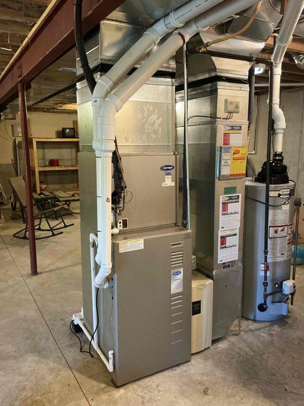 Conducted assessment of residential HVAC system experiencing inadequate cooling performance, with indoor temperature rising when system calls for cooling. Evaluated existing Carrier furnace and air conditioning equipment in basement mechanical room to determine system condition and replacement requirements. Provided comprehensive estimate for AC replacement to restore proper cooling functionality.