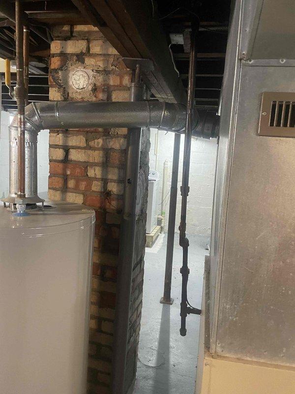 Conducted comprehensive site assessment for full HVAC system replacement including furnace and air conditioning unit installation. Evaluated existing 16-year-old furnace located in basement area, documented electrical panel capacity and circuit breaker configuration to ensure adequate power supply for new equipment, and assessed ductwork connections, venting requirements through existing brick chimney structure, and available installation space near water heater and utility areas. Provided detailed estimate for complete system replacement to meet customer's timeline of installation within one month.