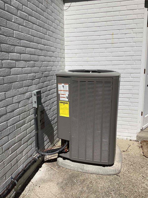 Completed full HVAC system installation including 110,000 BTU furnace and 4-ton air conditioning condenser unit positioned on concrete pad at rear of property. Installed refrigerant lines and electrical conduit along exterior wall, reconnected all necessary connections, and integrated humidifier into system. All mechanical permits obtained and installation completed per specifications with equipment operational and tested.