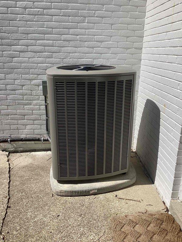 Completed full HVAC system installation including 110,000 BTU furnace and 4-ton air conditioning condenser unit positioned on concrete pad at rear of property. Installed refrigerant lines and electrical conduit along exterior wall, reconnected all necessary connections, and integrated humidifier into system. All mechanical permits obtained and installation completed per specifications with equipment operational and tested.