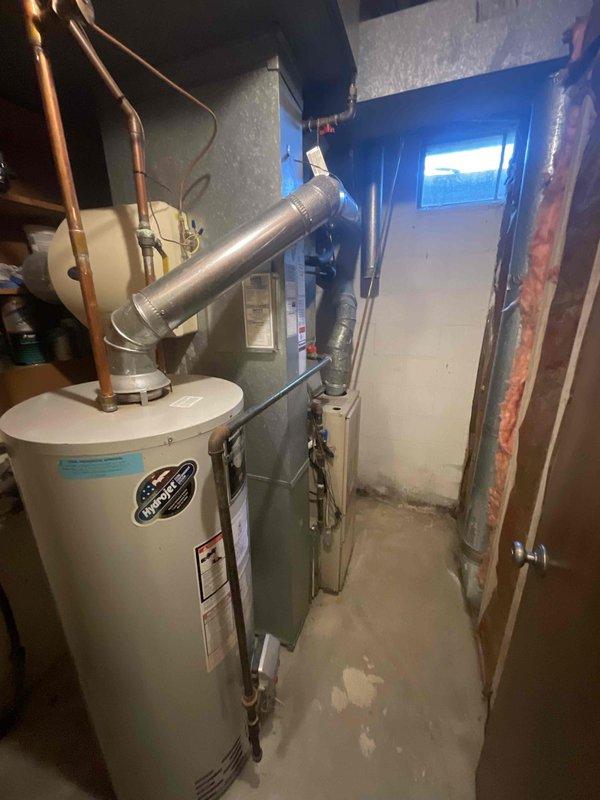 Provided comprehensive estimate for natural gas furnace replacement and ductwork modifications in basement location of duplex unit. Assessment revealed inadequate airflow to lower level and existing furnace with cracked heat exchanger requiring complete system replacement. Evaluated existing mechanical room layout, electrical service capacity, and current ductwork configuration to develop replacement solution addressing both equipment failure and airflow deficiencies throughout the home.
