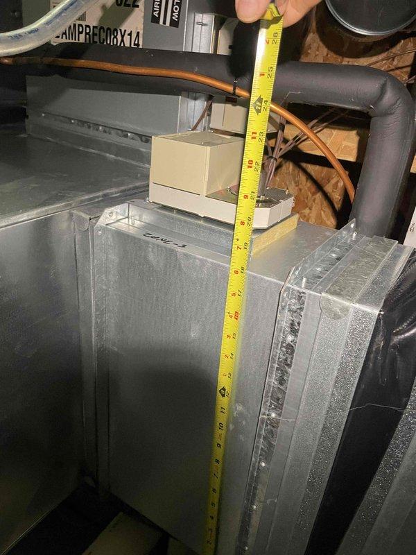 Conducted comprehensive assessment of existing 9-year-old Carrier 4-ton air conditioning system located in basement with upstairs cooling deficiencies. Unit operates continuously but fails to adequately cool upper level, indicating undersized equipment for home's cooling load requirements. Performed detailed measurements of existing ductwork and equipment clearances in attic installation area. Evaluated natural gas furnace integration and current HVAC infrastructure including ductwork configuration, refrigerant line routing, and ventilation components. Documented equipment specifications, spatial constraints, and existing system layout to prepare replacement estimate for properly sized cooling system that will meet home's calculated load requirements and resolve inadequate upstairs temperature control issues.