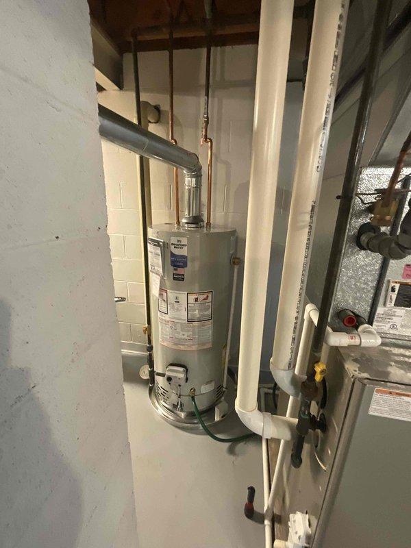 Conducted comprehensive site evaluation for full HVAC system replacement at residential property. Assessed existing outdoor condensing unit and air handler located in exterior mechanical area, noting accumulated weathering and operational wear on components. Evaluated basement-installed water heater and associated plumbing connections, including copper lines and PVC venting system. Documented current equipment configuration, ductwork layout, and structural mounting arrangements. Provided detailed replacement quote for new furnace and air conditioning system to address aging equipment. Customer confirmed existing system currently operational but requested upgrade proposal for complete heating and cooling equipment replacement within 2-4 month timeframe.