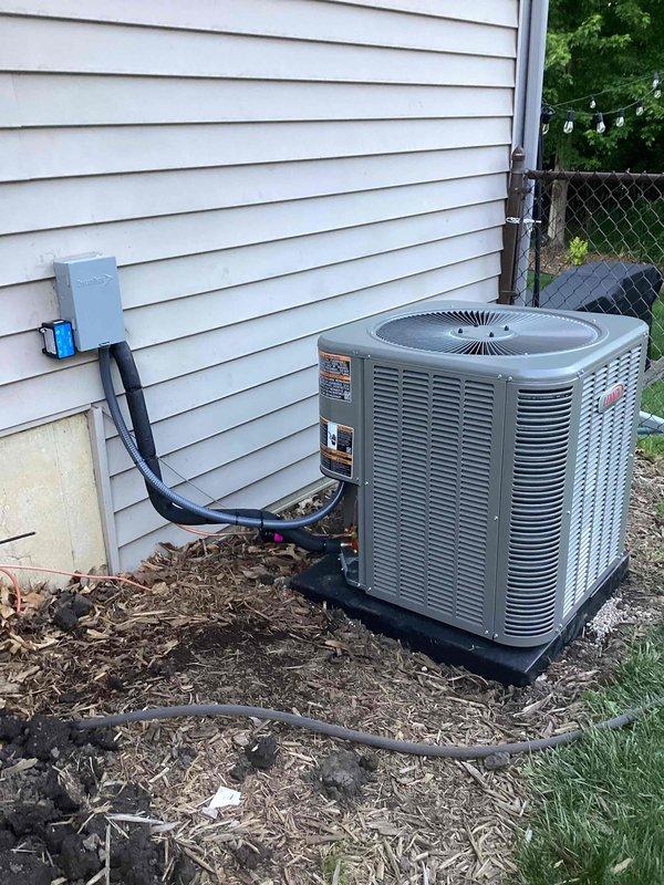 Completed full HVAC system installation including a 110,000 BTU gas furnace and 4-ton air conditioning unit with right-side configuration. Installed humidifier, ran refrigerant lines and electrical conduit to outdoor condenser unit positioned on pad against exterior wall with disconnect box mounted to siding. Reconnected all necessary utilities, installed Sensi digital thermostat, and verified system operation. All required mechanical and electrical permits were obtained prior to installation.