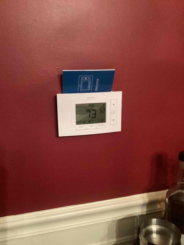 Completed full HVAC system installation including a 110,000 BTU gas furnace and 4-ton air conditioning unit with right-side configuration. Installed humidifier, ran refrigerant lines and electrical conduit to outdoor condenser unit positioned on pad against exterior wall with disconnect box mounted to siding. Reconnected all necessary utilities, installed Sensi digital thermostat, and verified system operation. All required mechanical and electrical permits were obtained prior to installation.
