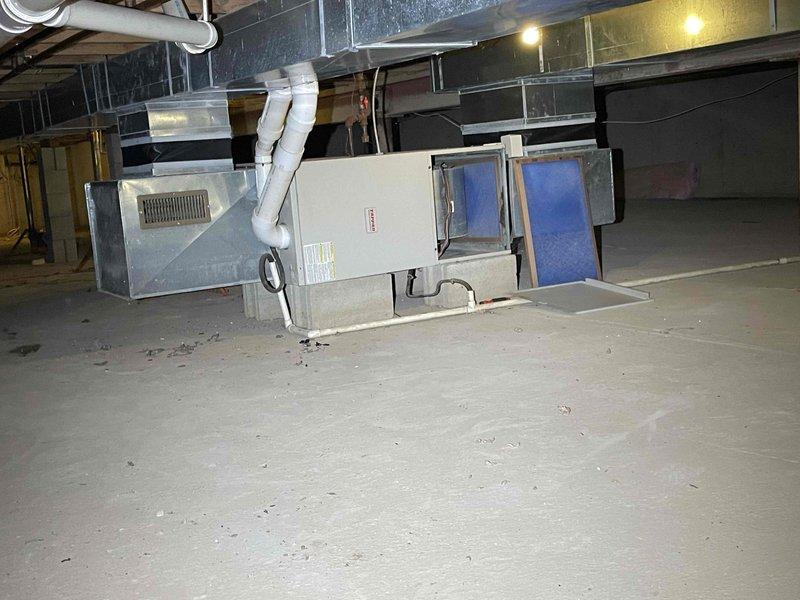 Provided comprehensive replacement estimate for furnace, air conditioning system, and humidifier installation in low-clearance basement/crawl space area. Evaluated existing 2004 furnace-only system and assessed space constraints for full HVAC system upgrade including ductwork modifications, electrical requirements, and equipment placement considerations given the limited vertical clearance in mechanical room.