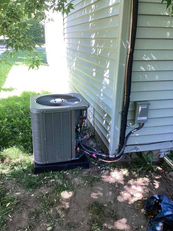 Completed full HVAC system installation including a 45,000 BTU furnace and 1.5 ton air conditioning unit. Installed furnace in basement utility area with proper ventilation ducting and connections, positioned on left side configuration with reconnection to existing infrastructure. Mounted outdoor condenser unit on exterior grade with refrigerant lines and electrical conduit run along siding to disconnect box. All permits secured prior to installation, system installed per mechanical specifications and code requirements.