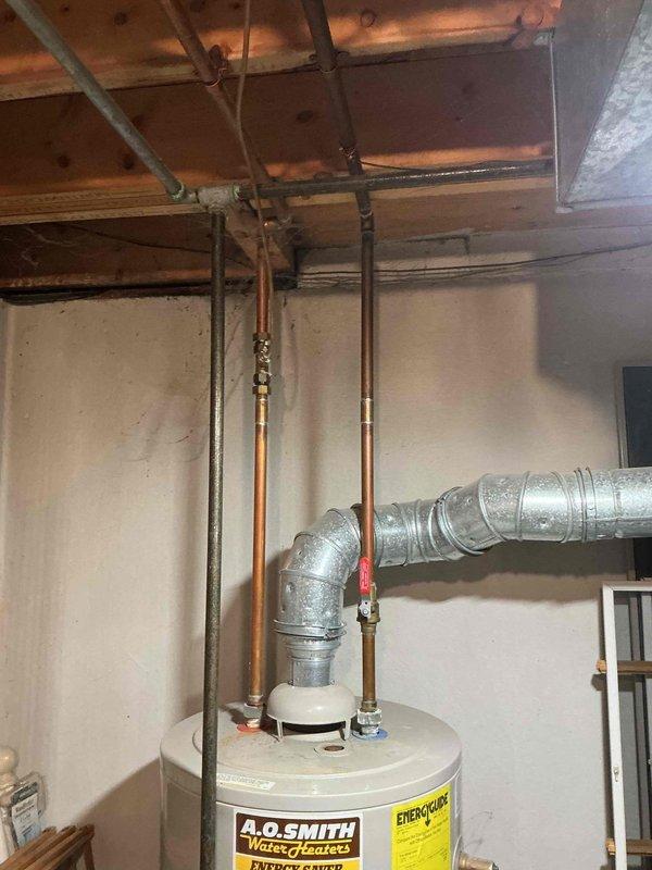 Responded to service call for water heater replacement quote. Upon arrival, inspected existing A.O. Smith tank-type water heater located in basement utility area. Unit was confirmed to be over 8 years old and customer requested pricing for new water heater installation. Documented current installation configuration including copper supply lines, venting system with flexible aluminum ductwork, and shutoff valve locations. Photographed existing equipment and plumbing connections to provide accurate replacement quote for comparable unit.