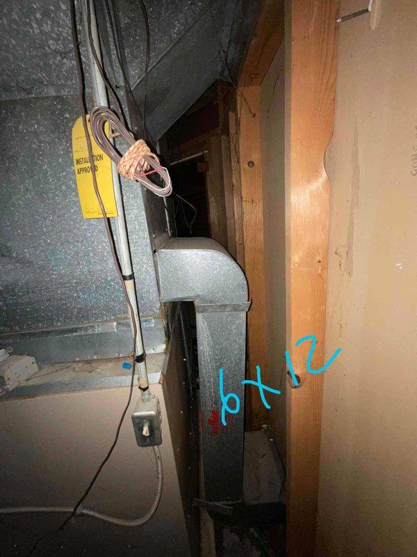 Conducted on-site assessment for HVAC system replacement estimate as part of furnace and air conditioner upgrade inquiry. Evaluated existing air conditioning equipment and ductwork configuration in mechanical space, documenting current system installation including air handler unit and associated ductwork connections. Photographed equipment layout and existing infrastructure to support replacement proposal development for complete heating and cooling system upgrade.