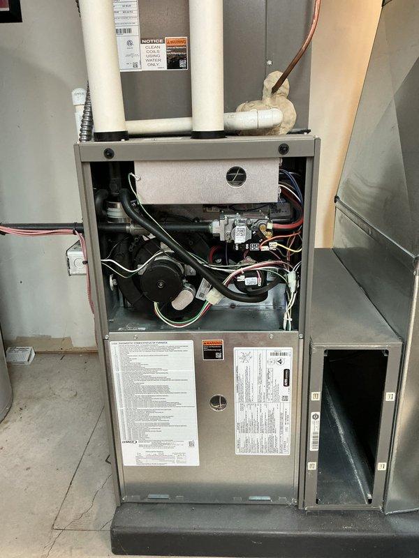 Completed comprehensive ComfortGuard Maintenance package on a five-year-old Lennox heating and cooling system. Performed full furnace inspection with blower motor assessment, gas valve verification, and heat exchanger examination with front access panel removed for thorough component evaluation. Conducted complete AC tune-up on outdoor condensing unit, including fan motor operation check, refrigerant line inspection, and condenser coil assessment. Verified all electrical connections, tested safety controls, inspected condensate drainage system including PVC discharge lines, and confirmed proper airflow throughout the system. Both furnace and air conditioning units operating within manufacturer specifications with no deficiencies noted; system remains under warranty and performing efficiently.