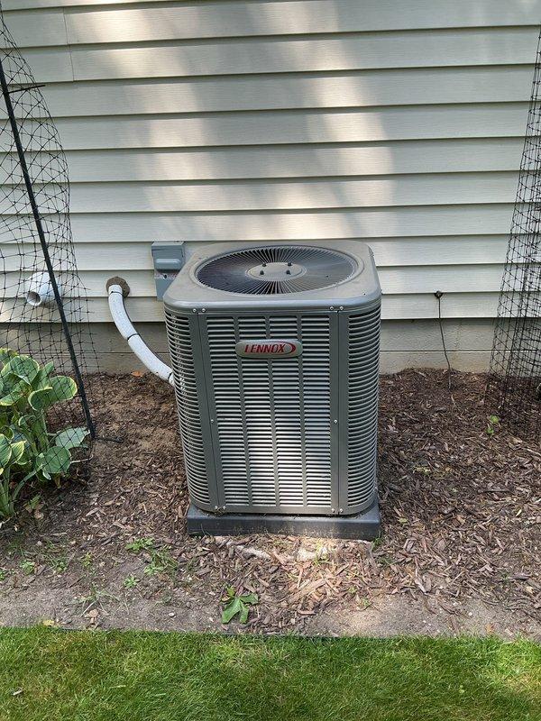 Completed comprehensive ComfortGuard Maintenance package on a five-year-old Lennox heating and cooling system. Performed full furnace inspection with blower motor assessment, gas valve verification, and heat exchanger examination with front access panel removed for thorough component evaluation. Conducted complete AC tune-up on outdoor condensing unit, including fan motor operation check, refrigerant line inspection, and condenser coil assessment. Verified all electrical connections, tested safety controls, inspected condensate drainage system including PVC discharge lines, and confirmed proper airflow throughout the system. Both furnace and air conditioning units operating within manufacturer specifications with no deficiencies noted; system remains under warranty and performing efficiently.