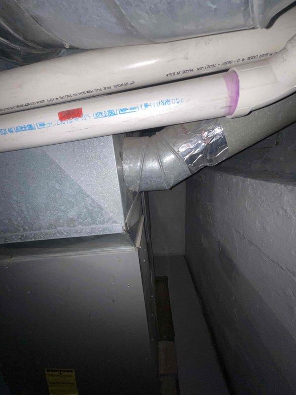 Completed site assessment for new mini-split installation in living room area. Evaluated basement mechanical space, documenting existing HVAC infrastructure including furnace, water heater, and ductwork configuration to determine optimal routing for refrigerant lines and condensate drainage. Confirmed structural conditions and available pathways for line set installation from exterior condenser location to interior air handler placement.