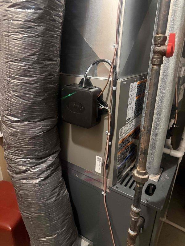 Completed installation of 2-ton Lennox air conditioning system with evaporator coil. Installed outdoor condenser unit on base pad at rear of property with proper refrigerant line connections and electrical disconnect. Mounted indoor evaporator coil to existing air handler in basement utility room, connected copper refrigerant lines with insulation, and installed brass service valves. System tested, charged to manufacturer specifications, and verified proper operation of all components.