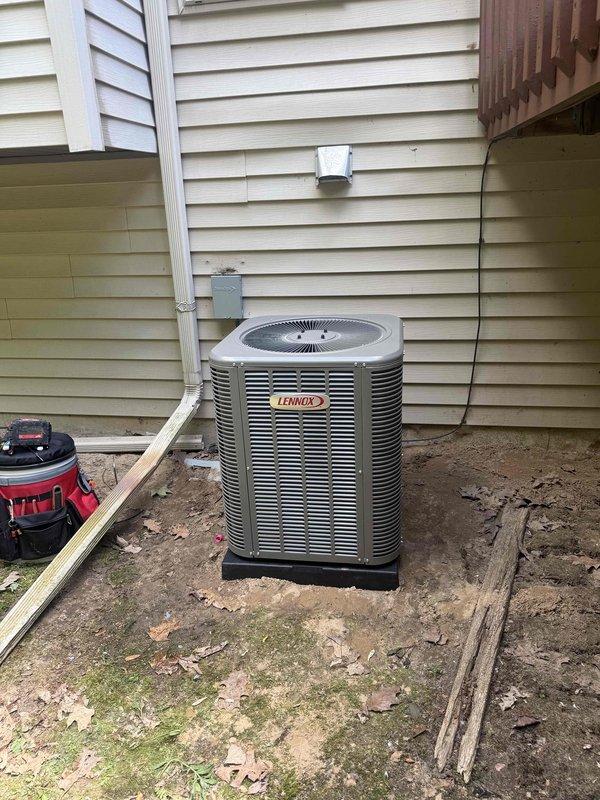 Completed installation of 2-ton Lennox air conditioning system with evaporator coil. Installed outdoor condenser unit on base pad at rear of property with proper refrigerant line connections and electrical disconnect. Mounted indoor evaporator coil to existing air handler in basement utility room, connected copper refrigerant lines with insulation, and installed brass service valves. System tested, charged to manufacturer specifications, and verified proper operation of all components.