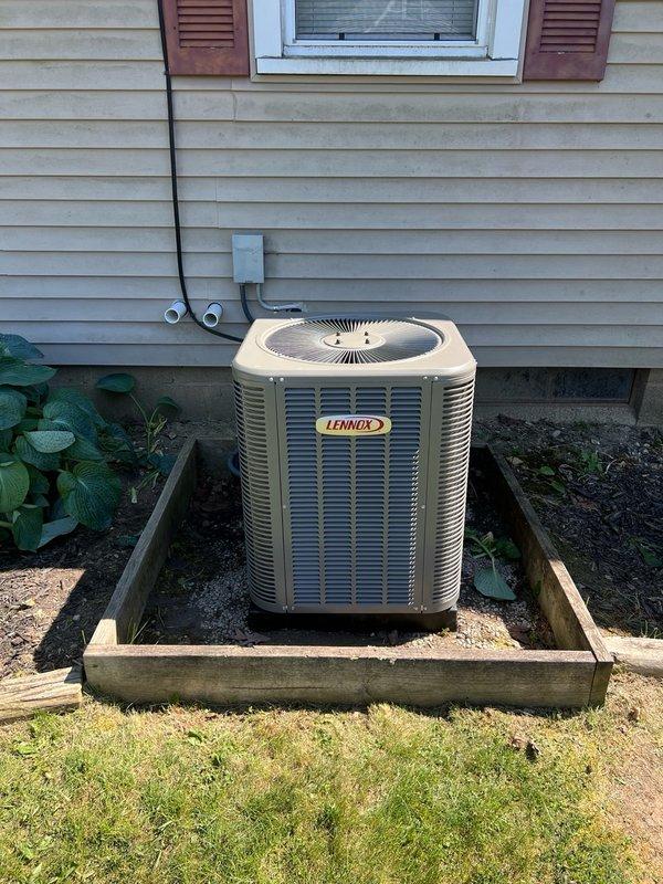 Completed full HVAC system installation including a 70,000 BTU furnace and 2-ton Lennox air conditioning unit with rear placement. Installed outdoor condenser on wooden platform with proper refrigerant line routing and electrical disconnect, upgraded electrical service with 100-amp panel to support new equipment, and reconnected all necessary utilities. All mechanical and electrical permits were obtained and work was performed to code specifications.