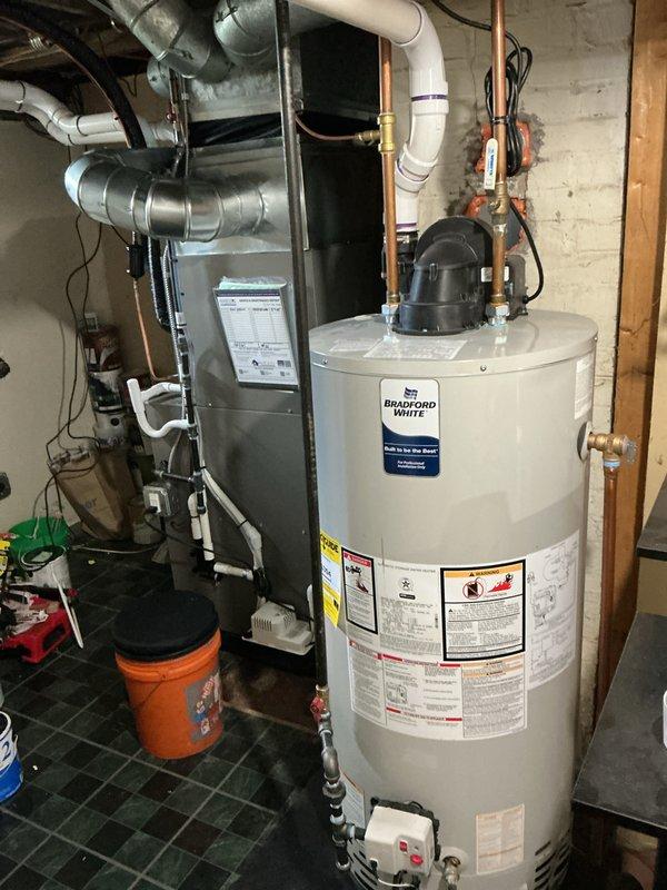 Completed routine Air Care Maintenance on Lennox HVAC system in residential basement utility room. Performed comprehensive inspection of furnace unit, verified proper operation of intake and exhaust venting through dual PVC pipes, checked copper refrigerant line connections, and inspected condensate drainage system for proper flow and functionality. All components operating within normal parameters with no issues identified.
