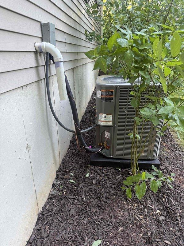 Completed full installation of 3-ton air conditioning system with evaporator coil replacement. Installed new outdoor condensing unit on exterior mulch bed with proper refrigerant line connections and PVC condensate drainage. Mounted new evaporator coil in basement utility area, connected to existing furnace system with copper refrigerant lines and condensate drain properly routed. System tested, charged to manufacturer specifications, and verified operational.