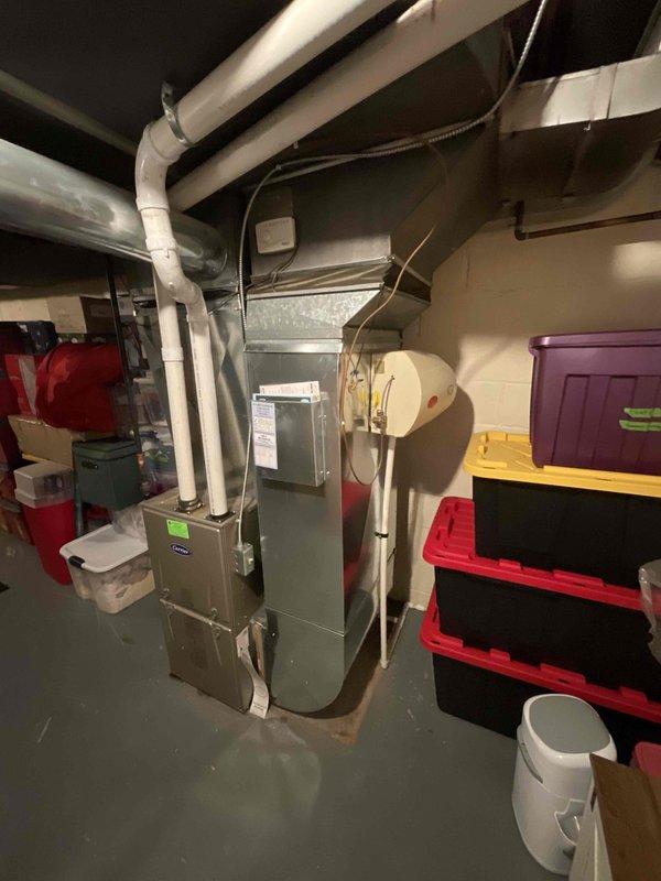 Completed on-site assessment for whole-house air conditioning system installation at residence with no existing AC equipment. Evaluated basement mechanical room containing Carrier furnace, water heater, and existing ductwork infrastructure to determine optimal placement and integration requirements for new cooling system. Provided comprehensive estimate for complete AC system installation including outdoor condensing unit, indoor evaporator coil, refrigerant lines, electrical connections, and necessary modifications to existing ductwork for whole-house cooling distribution.