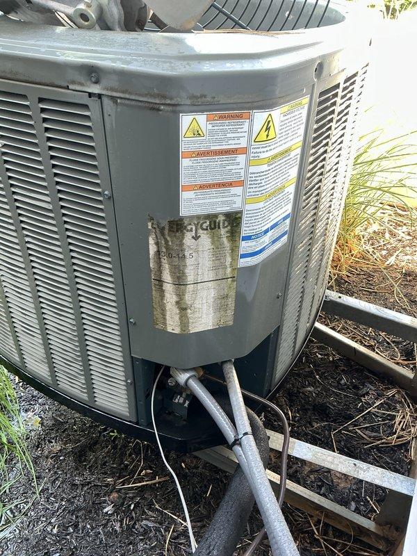Completed annual cooling maintenance on residential air conditioning system. Performed comprehensive inspection of outdoor condensing unit, including visual assessment of compressor assembly which revealed significant rust corrosion on upper dome surface. Documented equipment condition with photographs showing compressor deterioration, refrigerant line connections, and overall unit status. All electrical connections, condenser coils, and mounting hardware were inspected as part of routine preventive maintenance protocol.