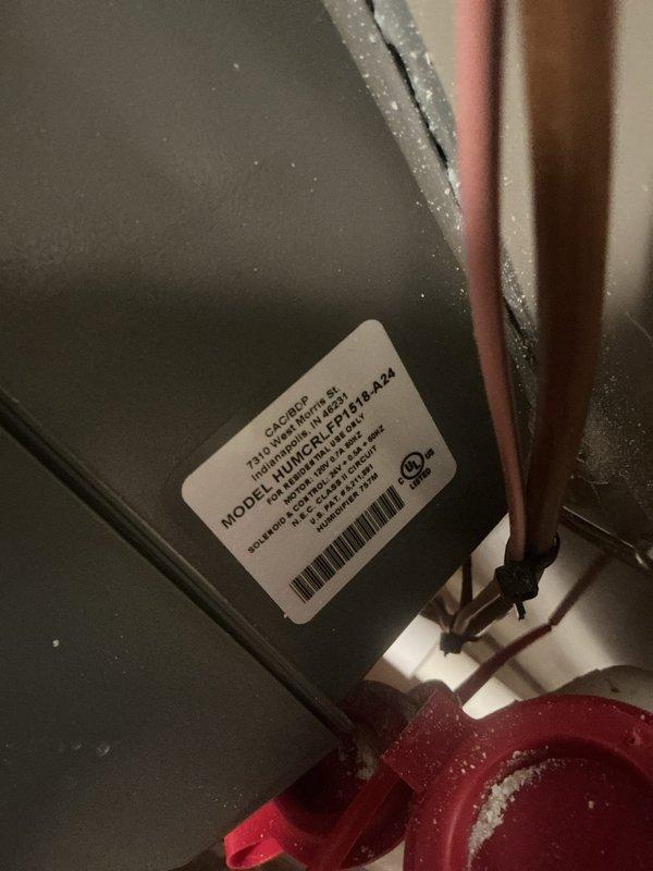 Completed annual cooling maintenance on residential HVAC system including inspection of Aprilaire humidifier unit mounted on supply ductwork and evaluation of air handler model H10HSCLFLE416-A24. Observed normal condensation on refrigerant lines and equipment surfaces indicating proper system operation in cooling mode, verified all components secured and functioning within normal parameters.