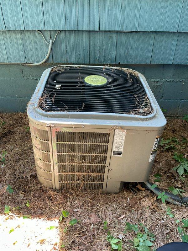 Completed annual cooling maintenance on residential outdoor condenser unit. Performed comprehensive system inspection, cleaned condenser coils, removed debris and cobwebs from top grille and surrounding area, verified refrigerant lines and electrical connections, and confirmed unit operational status for upcoming cooling season.