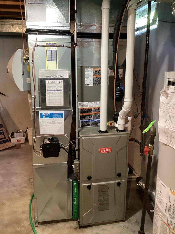 Completed installation of 2.5-ton air conditioning system with evaporator coil on left side of residence. Connected refrigerant lines to existing Bryant furnace and air handler in basement mechanical room, installed exterior condensing unit, and ran all necessary electrical and refrigerant piping. System tested, charged to manufacturer specifications, and verified proper operation with all required permits obtained prior to installation.